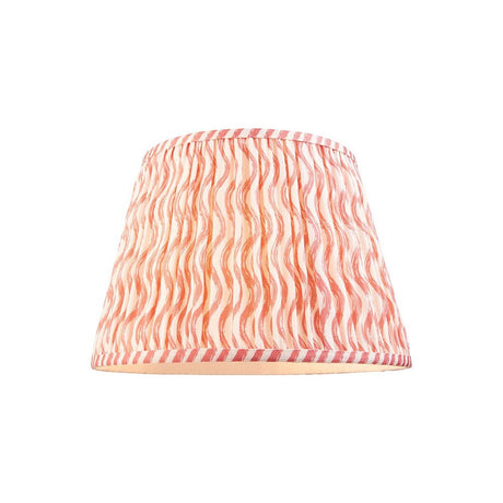 Endon Chartwood 35cm tapered lamp shade in coral pink pleated faux linen with a rippled print and taped edges, shown on a plain white background.