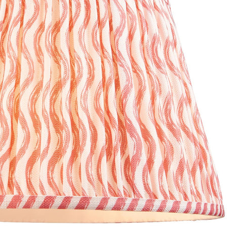 Endon Chartwood 35cm tapered lamp shade in coral pink and white faux linen, shown close up with pleated ripple print and taped striped edge trim.