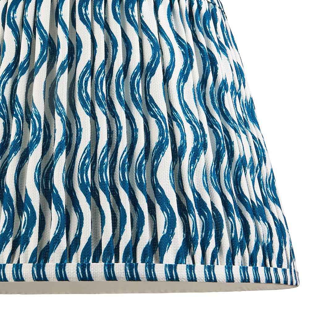 Endon Chartwood 35cm tapered lamp shade in marlin blue and white, close-up of the pleated faux linen with a rippled wave print and taped edge trim.