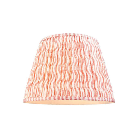 Endon Chartwood 40cm tapered lamp shade in pleated faux linen with a coral pink and white ripple print and taped edges, on a plain background.