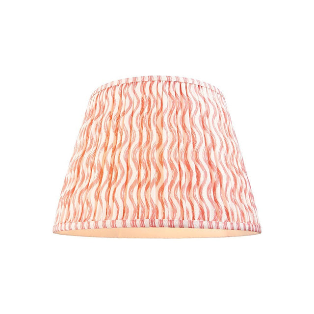 Endon Chartwood 40cm tapered lamp shade in pleated faux linen with a coral pink and white ripple print and taped edges, on a plain background.