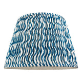 Endon Chartwood 40cm tapered lamp shade in marlin blue and white pleated faux linen with a rippled wave print and taped edging, on a plain background.