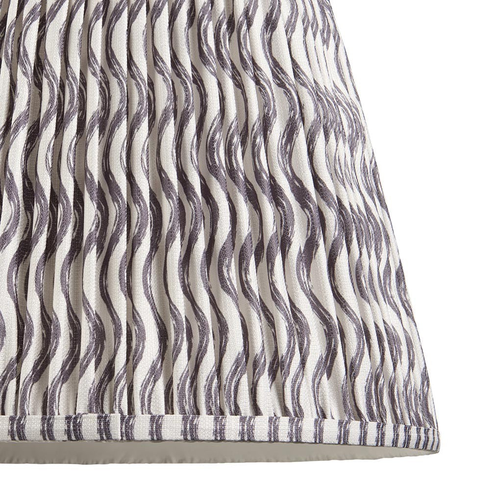 Close-up of Endon Chartwood 40cm tapered lamp shade in pearl grey pleated faux linen with a soft grey ripple print and taped edge detailing.