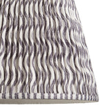 Close-up of Endon Chartwood 40cm tapered lamp shade in pearl grey pleated faux linen with a soft grey ripple print and taped edge detailing.