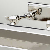 Close-up of the Chawton Medium Picture Light - Polished Nickel, showcasing its shiny, reflective surface and interconnected cylindrical components with adjustable knuckle joints against a plain background.