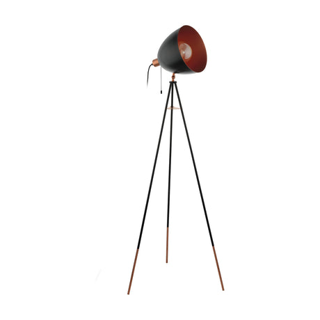Chester tripod floor lamp in black and copper steel, with slim black legs on copper tipped feet and a tilting spotlight-style shade, black outside with copper interior, on a plain white background.