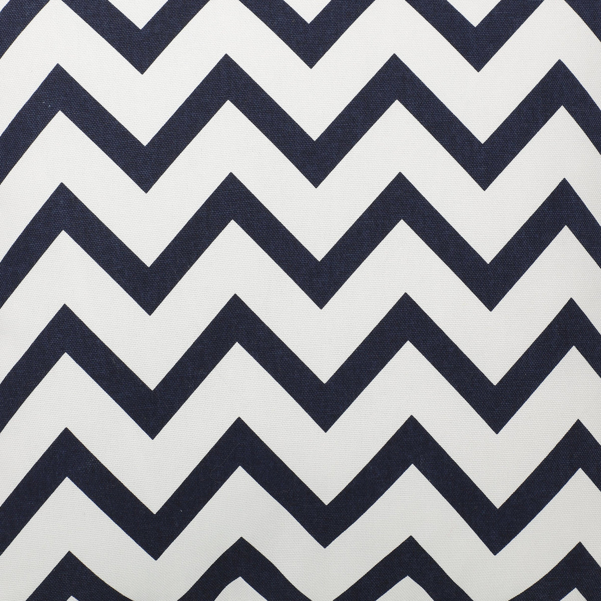 Chevery Cushion cover close-up showing a bold navy blue and white chevron zigzag pattern printed on textured 100% cotton fabric.