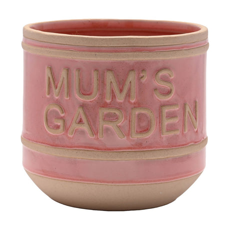 Pink ceramic planter from the Mum's Garden & Plant Lady set, round stoneware pot with raised "MUM'S GARDEN" text and beige rim and base bands, on a plain white background.