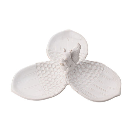 White glazed ceramic serving tray with three acorn-shaped dishes joined by a central squirrel figure, textured cup ends and smooth lined nut ends, shown on a plain background.
