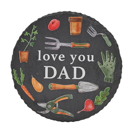 Round charcoal slate coaster from the Garden Tools set, printed with love you DAD in white lettering surrounded by watercolour-style illustrations of tools, pots and vegetables.