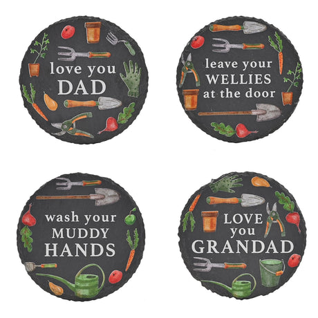 Set of 4 round charcoal slate coasters with garden tool illustrations and white text reading "love you DAD", "leave your WELLIES at the door", "wash your MUDDY HANDS" and "LOVE you GRANDAD".