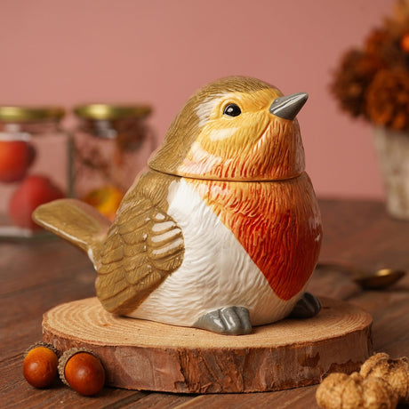 Ceramic Sculpted Robin Storage Jar, 300ml, with removable head lid, orange-red breast, white belly, and textured brown wings, shown on a wood slice with acorns.
