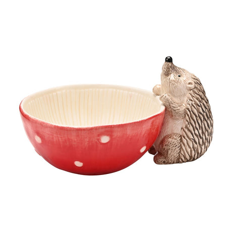 Round Toadstool & Hedgehog Serving Bowl 450ml, red spotted exterior resembling a mushroom cap, cream ribbed interior, with a beige hedgehog figure holding the rim, on a plain white background.