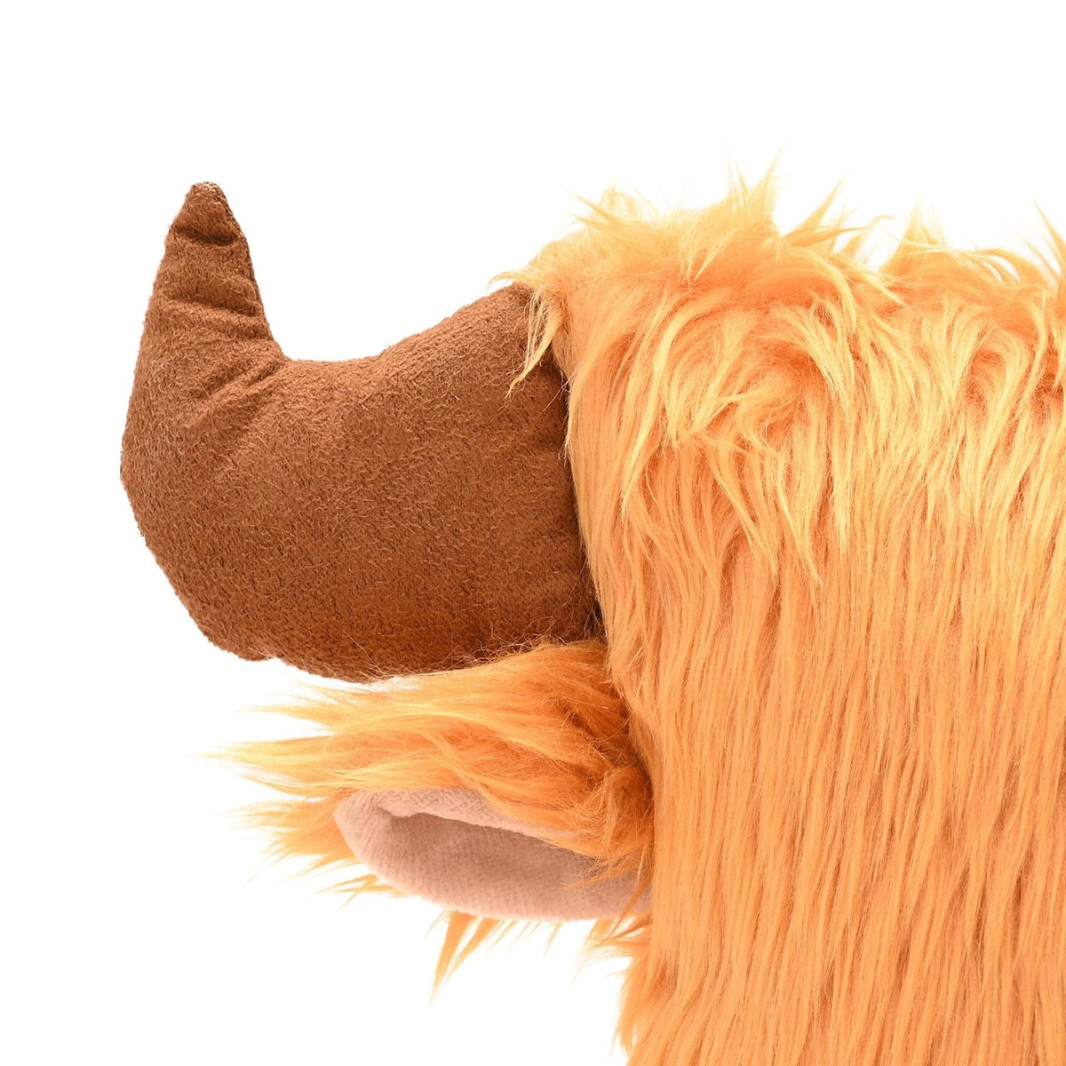 Close-up of the Square Shaggy Highland Cow Head Cushion with Horns in brown, showing a curved horn, tucked ear with pale inner fabric, and shaggy pile against a white background.