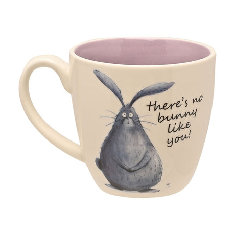 White earthenware mug with pink interior, featuring a hand-drawn grey rabbit and "there's no bunny like you" script, shown with handle on a plain white background.