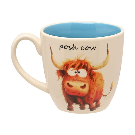 White earthenware "Posh Cow" mug with blue interior, featuring an illustrated ginger Highland cow and black script text, shown on a plain white background.