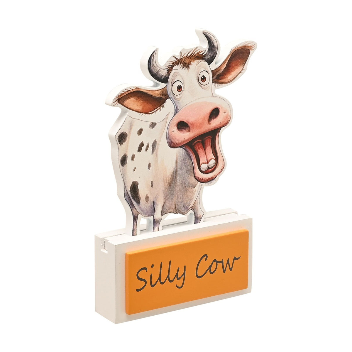 Wooden standing plaque shaped like a wide-eyed cartoon cow with white spotted coat and grey horns, on a white base with an orange "Silly Cow" panel, plain white background.