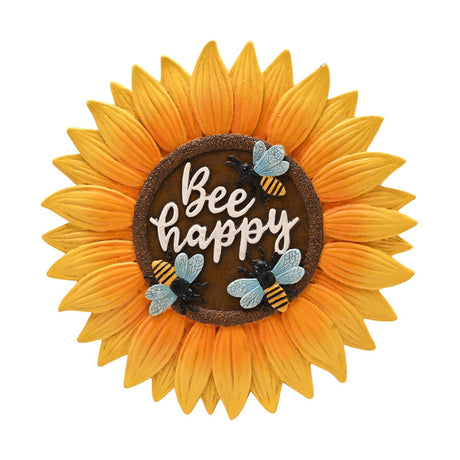 Round sunflower resin stepping stone with yellow petals deepening to orange, a brown textured centre reading "Bee happy", and three bee decorations, on a plain white background.