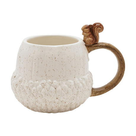 Cream ceramic acorn mug with a brown squirrel figure on the handle, featuring a ribbed upper body and textured, scaly base, shown on a white background.