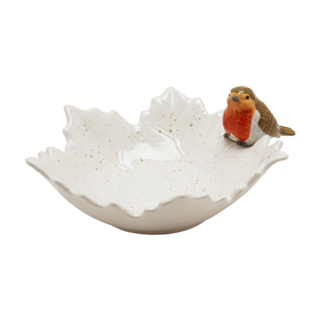 Large speckled cream ceramic leaf-shaped plate with raised veined texture and a painted robin figure perched on its rim, shown on a plain white background.