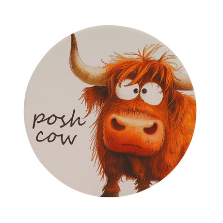 Round ceramic coaster with a shaggy ginger Highland cow illustration, curved horn, googly eyes, and "posh cow" handwritten text on a white background.