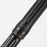 A close-up of a dark metal rod showcases its grooved, ridged texture against a plain white background. Reminiscent of the sleek design of the Cleveland Single Head Lamp Post in Weathered Bronze, it features circular bands and a smooth finish, perfect for enhancing any outdoor lighting setup.
