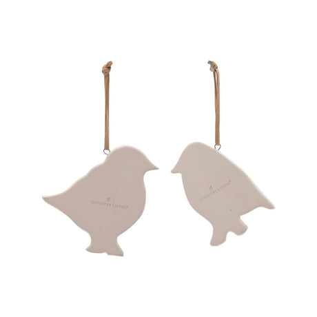 Set of 2 stoneware bird plaques in flat cream finish, each with a tan leather hanging strap, shown reverse side with embossed Country Living logo on a white background.