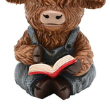 Sitting Highland Cow Reading Resin Figurine - Brown & Blue