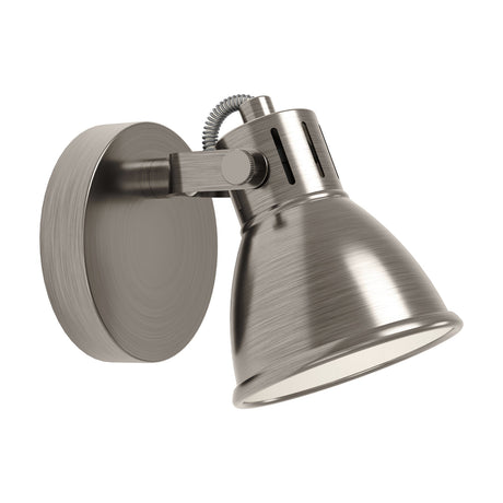 Clasanne wall spotlight with a round antique nickel backplate, adjustable arm with knurled thumb screws, and bell-shaped shade with cream lining, shown on a plain white background.