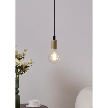 Pendant light with wood-effect fitting and black cable holding a clear G95 LED globe bulb, lit warm white, beside flowers and a teacup on a side table.