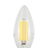 Close-up of a clear LED candle bulb, E14 fitting, C35 shape, with visible upright filaments, 7W, 806lm, warm white, on a plain white background.