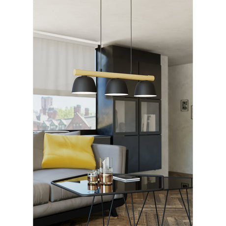 Clomenne Linear Pendant Light with three black dome shades on a wood-tone bar, hung above a glass coffee table in a living room setting.