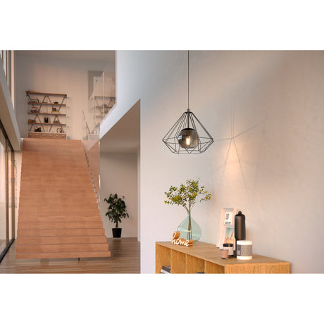 Clorbelle Smoked Glass Pendant Light 44.5cm in black, diamond-shaped steel wire cage with glass globe, hung above a wooden sideboard in a hallway setting.