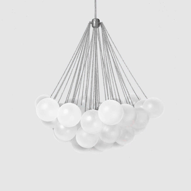The Orb 17 Light Cluster Suspension - Silver features multiple frosted glass spheres elegantly suspended by metal cables from a central point, all against a plain light gray background.