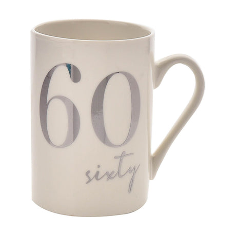 White ceramic birthday mug with a C-shaped handle, featuring a large silver foiled "60" and "sixty" script, 11oz, shown on a plain white background.