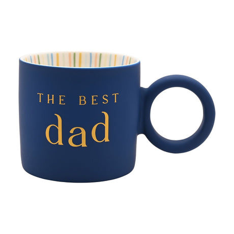 Navy porcelain mug with "THE BEST dad" in gold lettering, matt exterior, cream striped interior, and a full round ring handle, shown on a plain white background.