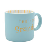 Light blue matt porcelain mug with "THE BEST grandad" lettered in gold, gold-striped white interior, C-shaped handle, shown on a plain white background.