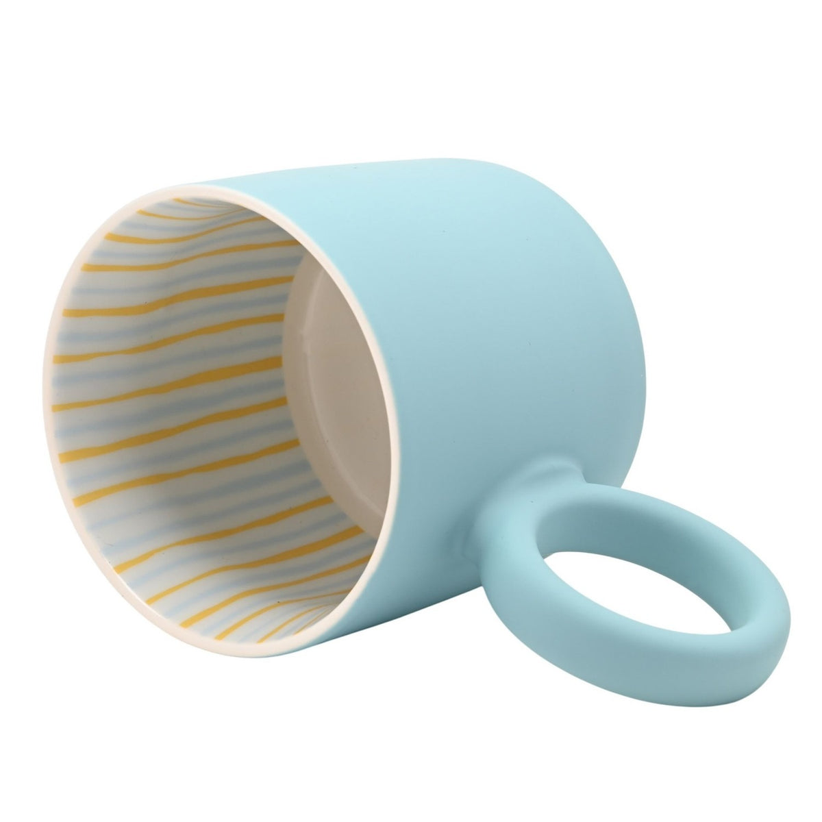 Light blue matt porcelain mug tipped on its side, showing white interior with gold and blue horizontal stripes and a matching handle, on a plain white background.