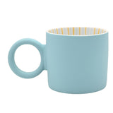Light blue matt porcelain mug with a round loop handle, shown from the side on a plain white background, revealing a white interior with fine gold vertical stripes.
