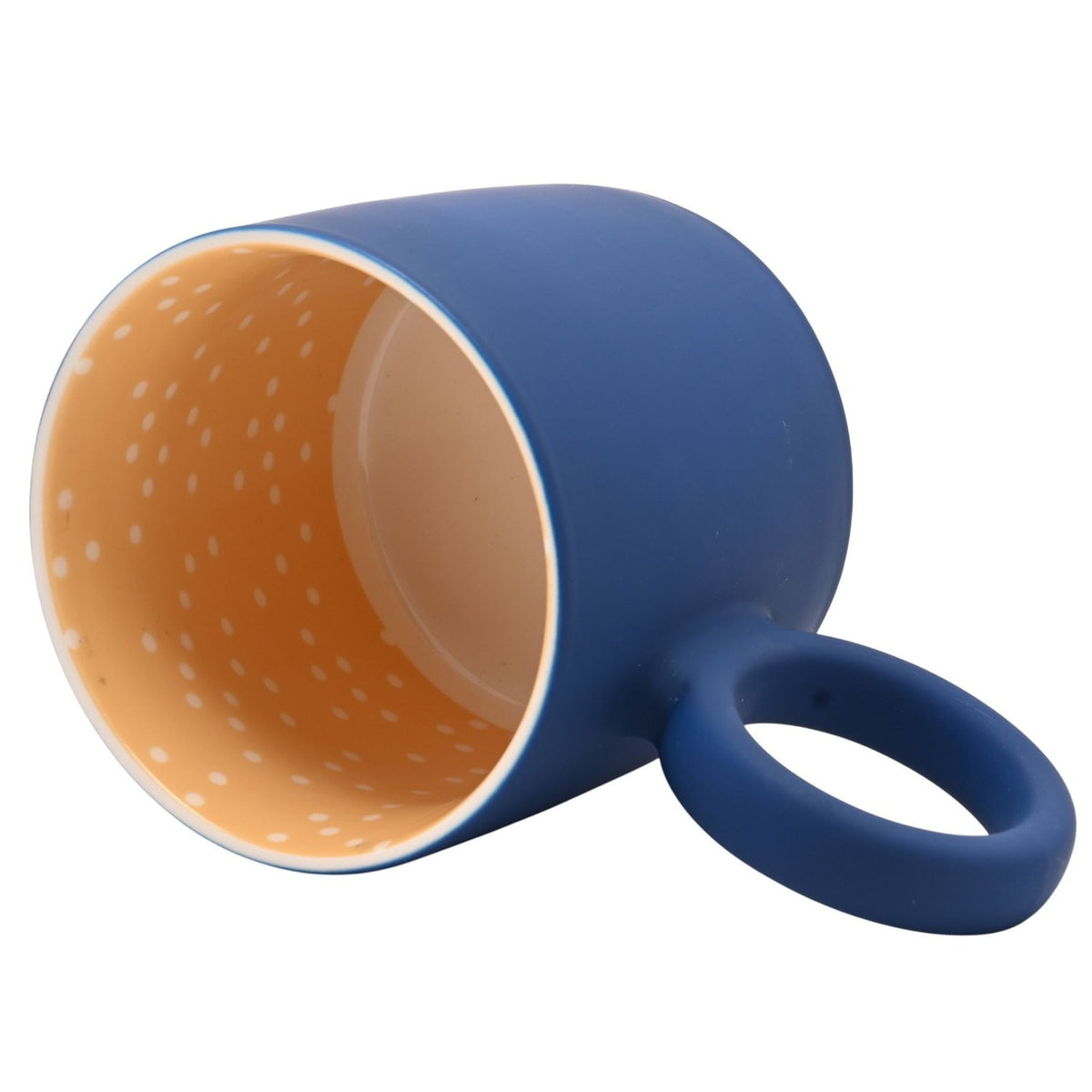Happily Retired Male matt porcelain mug tipped on its side, showing a navy exterior, round navy ring handle, and yellow interior with white spots, on a plain white background.