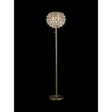 The Coniston 3 Light Crystal Floor Lamp in Antique Brass features a slim stand, round base, and a decorative shade with hanging crystal-like elements for a sparkling, elegant look against a black background.