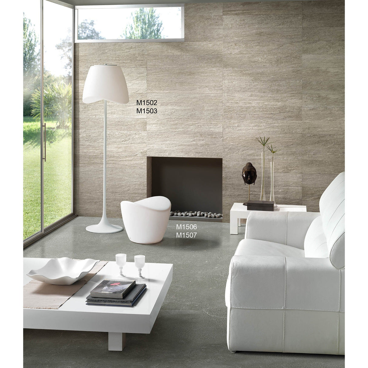 A living room with a fireplace and white couch, accented by the Cool 2 Light Outdoor Floor Lamp in matt white and opal white, bringing a modern touch of garden lighting indoors.