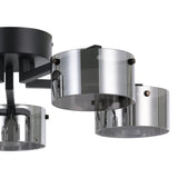 Close-up of the Copillos 5 Light Ceiling Light in black, showing a round steel canopy with short arms holding cylindrical smoked glass shades, set against a plain white background.