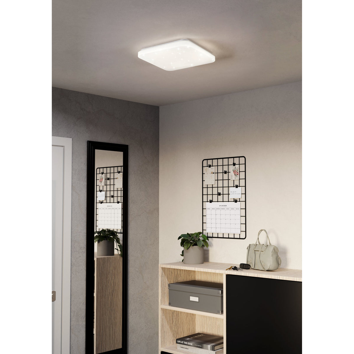 Crelvette square LED ceiling panel light, 33 x 33cm, white steel body with crystal-effect diffuser, shown flush-mounted on a hallway ceiling above a mirror and shelving unit.
