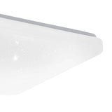 Close-up corner view of the Crelvette 33 x 33cm square LED ceiling panel light with white steel body and crystal-effect diffuser, shown on a plain white background.