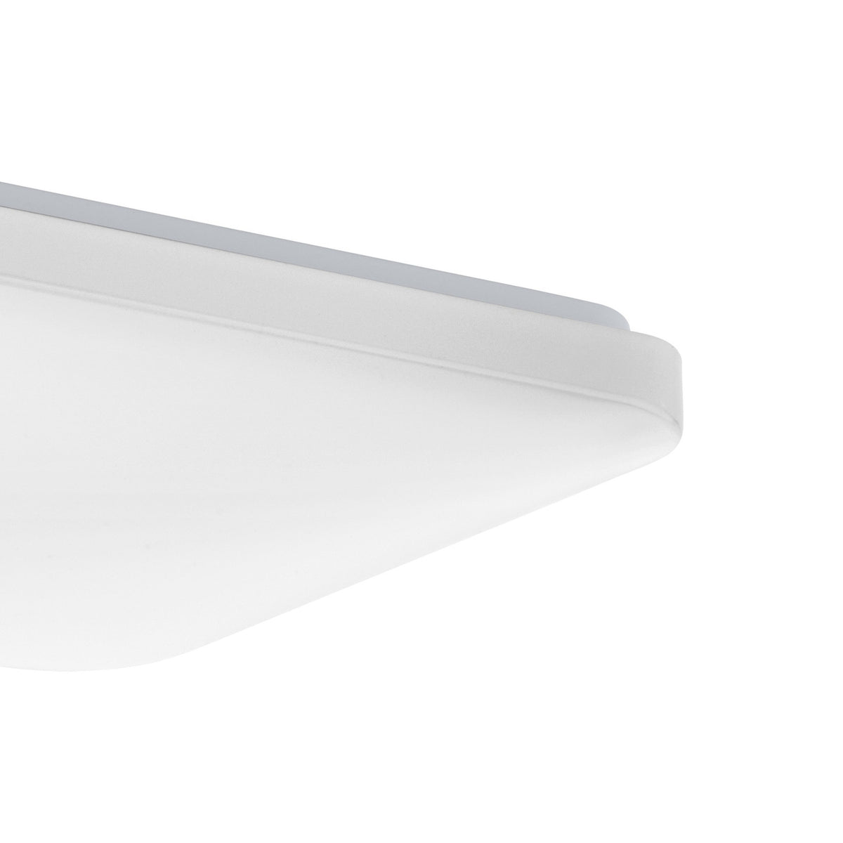 Close-up corner view of the Crelvette square LED ceiling panel light, 33 x 33cm, showing a white steel body with a white plastic diffuser and rounded edge, on a plain white background.