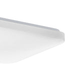 Close-up corner view of the Crelvette square LED ceiling panel light, 33 x 33cm, showing a white steel body with a white plastic diffuser and rounded edge, on a plain white background.