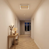 Crispieri square LED flush ceiling light with grey stone-effect centre bar and taupe trim, illuminated above a hallway with wooden flooring.