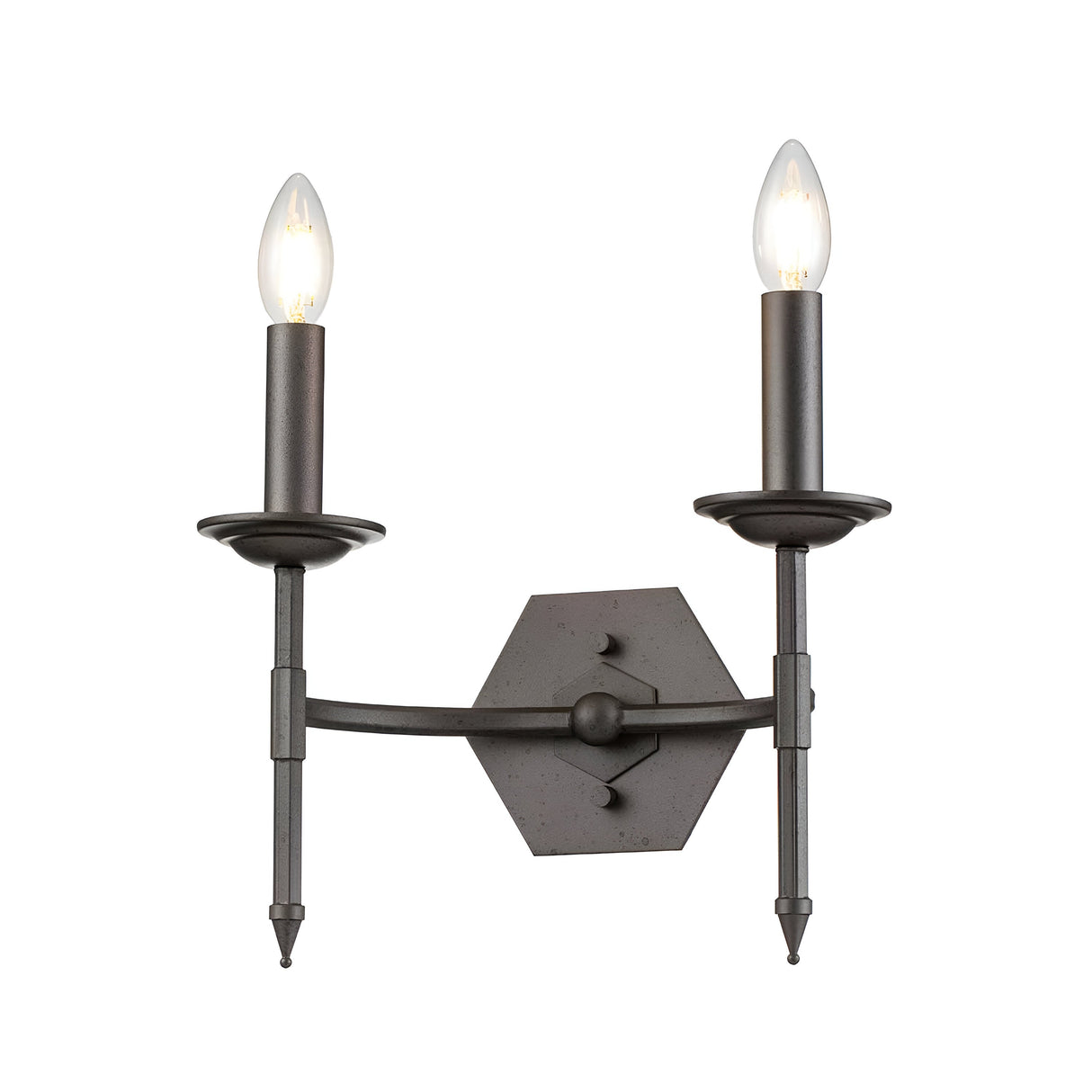 The Crown 2 Light Wall Light - Graphite showcases a timeless design with its black hexagonal structure and two candle-style bulbs. Its traditional elegance is further enhanced by a central mounting plate and slender arms, all finished in a sleek graphite tone.