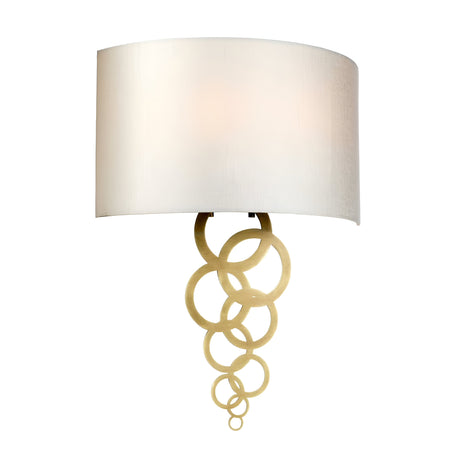 Introducing the Curtis Large Wall Light in Aged Brass, a contemporary wall-mounted fixture that showcases a white curved shade adorned with decorative gold rings elegantly hanging below.